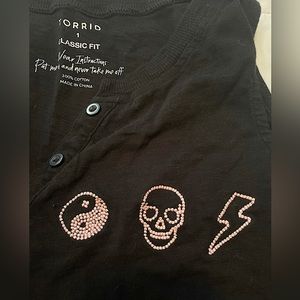 Torrid brand classic fit tank with embroidered symbols. Lightly worn.